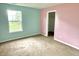 Bedroom with carpet, featuring a window and doorway to another room at 2154 Walnut Meadow Ct, Indianapolis, IN 46234
