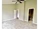 Spacious bedroom featuring gray ceramic tile flooring and a ceiling fan at 2154 Walnut Meadow Ct, Indianapolis, IN 46234
