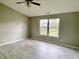 Spacious bedroom with tiled floor, large windows providing great natural light, and a ceiling fan at 2154 Walnut Meadow Ct, Indianapolis, IN 46234
