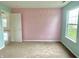 Bedroom featuring carpeted floors and walls painted in light blue and pink at 2154 Walnut Meadow Ct, Indianapolis, IN 46234