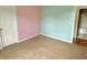 Inviting bedroom featuring two-tone walls with neutral carpet and an entry to another room at 2154 Walnut Meadow Ct, Indianapolis, IN 46234