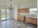 Inviting dining room featuring wood cabinets, sink and sliding glass doors to the backyard at 2154 Walnut Meadow Ct, Indianapolis, IN 46234