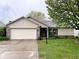Charming single-story home with a brick and vinyl facade and an attached two-car garage at 2154 Walnut Meadow Ct, Indianapolis, IN 46234