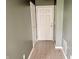 Hallway features neutral paint, tile flooring, and a white front door, offering a clean aesthetic at 2154 Walnut Meadow Ct, Indianapolis, IN 46234