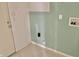 Utility room with basic hookups and minimalist design, providing a functional space for laundry appliances at 2154 Walnut Meadow Ct, Indianapolis, IN 46234