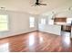 Bright living room featuring hardwood floors, a ceiling fan, and plentiful natural light at 2154 Walnut Meadow Ct, Indianapolis, IN 46234