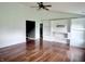 Spacious living room with hardwood floors, built-in shelving, and ample space for entertaining at 2154 Walnut Meadow Ct, Indianapolis, IN 46234