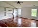 Bright and airy living room with hardwood floors, built-in shelving, and ample natural light at 2154 Walnut Meadow Ct, Indianapolis, IN 46234