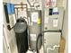 This utility room shows a water heater, a water filter system, and a modern American Standard furnace at 2154 Walnut Meadow Ct, Indianapolis, IN 46234