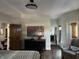 This stylish bedroom features a connecting bath, a comfortable seating area, and warm natural lighting at 2161 N Pennsylvania N St, Indianapolis, IN 46202
