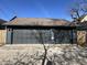 Three-car garage with dark gray doors and siding, with an abundance of parking at 2161 N Pennsylvania N St, Indianapolis, IN 46202