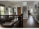 Hallway with hardwood floors, staircase, and views into other rooms at 2161 N Pennsylvania N St, Indianapolis, IN 46202