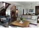 Bright and open living room with a cozy fireplace, hardwood floors, and comfortable seating at 2161 N Pennsylvania N St, Indianapolis, IN 46202