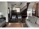 Bright living room featuring hardwood floors and a view of a brick fireplace and an open concept at 2161 N Pennsylvania N St, Indianapolis, IN 46202