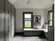 Mud room with ample storage, a built-in bench, and windows offering plenty of natural light at 2161 N Pennsylvania N St, Indianapolis, IN 46202