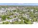 A picturesque residential neighborhood features tree-lined streets, well-kept lawns, and various architectural home styles at 223 Grove St, Greenfield, IN 46140