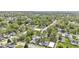 Extensive aerial perspective of a neighborhood, displaying homes nestled among mature trees at 223 Grove St, Greenfield, IN 46140