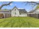 Spacious backyard featuring a well-maintained lawn and privacy fence at 223 Grove St, Greenfield, IN 46140