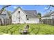 An expansive backyard with lush green grass, wooden fencing, and outdoor seating, perfect for relaxing and entertaining at 223 Grove St, Greenfield, IN 46140