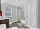Bathroom with wood floors, neutral walls, bathtub/shower and single sink at 223 Grove St, Greenfield, IN 46140