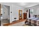 Inviting bedroom featuring wood floors, a closet, dresser and ample natural light at 223 Grove St, Greenfield, IN 46140