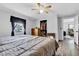Bedroom with hardwood floors, open closet, neutral walls and ceiling fan at 223 Grove St, Greenfield, IN 46140