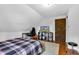 Bright bedroom featuring a desk, TV setup, and sleek laminate flooring at 223 Grove St, Greenfield, IN 46140