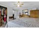 Bedroom with hardwood floors, open closet, neutral walls and ceiling fan at 223 Grove St, Greenfield, IN 46140