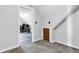 A bedroom featuring neutral carpeting, a small storage closet, and a small attic door at 223 Grove St, Greenfield, IN 46140