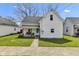 Charming two-story home with a cozy front porch and swing at 223 Grove St, Greenfield, IN 46140