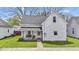 Charming home with a covered front porch and swing, offering a cozy and inviting entrance at 223 Grove St, Greenfield, IN 46140