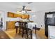 Kitchen with wood floors, dining table, oak cabinets and black refrigerator at 223 Grove St, Greenfield, IN 46140
