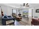 Cozy living room with hardwood floors, ceiling fan, and comfortable seating at 223 Grove St, Greenfield, IN 46140
