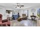 Spacious living room featuring wood-look floors and a cozy seating area at 223 Grove St, Greenfield, IN 46140
