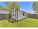 Spacious backyard shed with classic design and black trim at 223 Grove St, Greenfield, IN 46140
