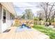 Cozy back deck overlooks the spacious yard and a newly constructed fence at 2763 Streamside Dr, Columbus, IN 47203
