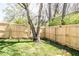 Backyard features a new fence and decorations on the tree at 2763 Streamside Dr, Columbus, IN 47203