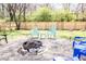 Enjoy a charming backyard with a fire pit and new wooden privacy fence at 2763 Streamside Dr, Columbus, IN 47203