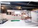Recreational basement area equipped with a basketball game, dartboard, and room for entertainment at 2763 Streamside Dr, Columbus, IN 47203
