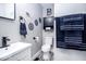 Chic bathroom with a vanity, toilet, and decor, accented by elegant black and white patterned floor tiles at 2763 Streamside Dr, Columbus, IN 47203