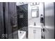 Stylishly renovated bathroom with a tiled shower/bath, sleek vanity, and modern black accents at 2763 Streamside Dr, Columbus, IN 47203