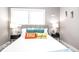 Bright bedroom with a stylish bed, colorful pillows, and charming decor at 2763 Streamside Dr, Columbus, IN 47203