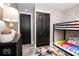 bedroom featuring bunk beds, a splash of color, and stylish gray walls at 2763 Streamside Dr, Columbus, IN 47203