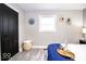 Stylish bedroom features a cozy bed, wine glasses, and unique wall art at 2763 Streamside Dr, Columbus, IN 47203
