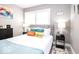 Beautiful bedroom with bright pillows, stylish decor, and natural light at 2763 Streamside Dr, Columbus, IN 47203