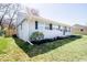 Landscaped front yard with healthy green grass around a light blue home at 2763 Streamside Dr, Columbus, IN 47203