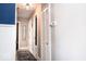 Well-lit hallway with fresh paint, updated trim, and access to rooms at 2763 Streamside Dr, Columbus, IN 47203