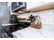 Modern kitchen boasts marble counters, subway tile backsplash, and stainless steel appliances at 2763 Streamside Dr, Columbus, IN 47203