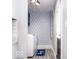 Charming laundry room offers patterned wallpaper, new machines, and updated lighting at 2763 Streamside Dr, Columbus, IN 47203