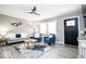 Bright living room featuring stylish furnishings, including cozy sofas and chairs, enhanced by natural light at 2763 Streamside Dr, Columbus, IN 47203